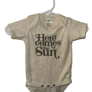 Cream Bodysuit with Retro Print Snap Closure